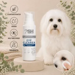PSH Eye Cleaner med planteekstrakter, der renser området omkring hundens øjne og modvirker tårestriber – vist med en Coton de Tuléar