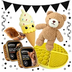 Hvalpepakke med Teddy-bamse, latex-isvaffel, gul slikkemåtte, kalveklov og to bægre vådfoder, vist med Black November-flagguirlande