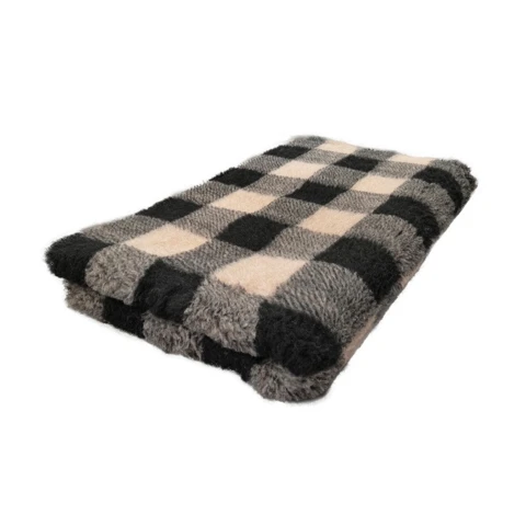 Blødt vetbed tæppe holdt i creme og brune nuancer