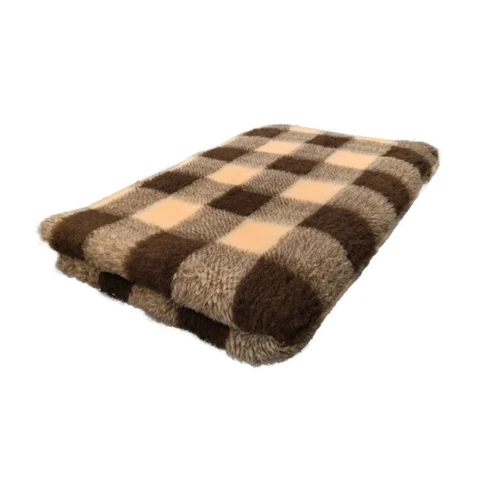 Blødt vetbed tæppe holdt i mørke, brunlige nuancer