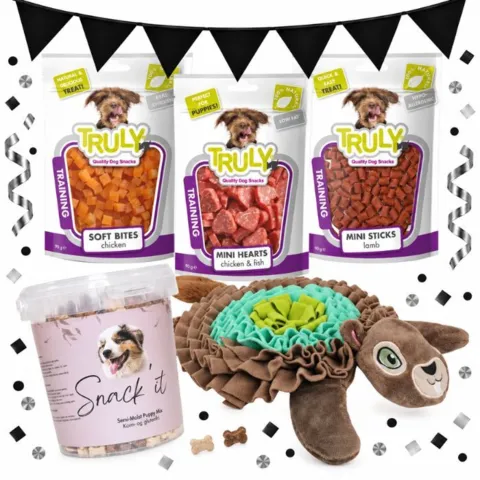 Hvalpepakke med AFP Egon Egern snusemåtte, Snack’it Puppy Mix og tre poser Truly-godbidder, vist med Black November-flagguirlande